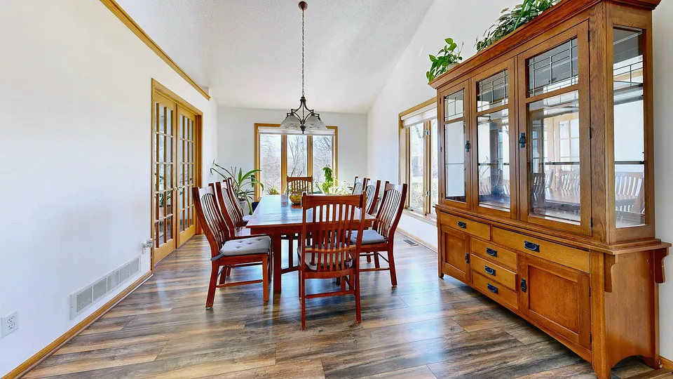 Dining room with a tall wood china cabinet along one wall