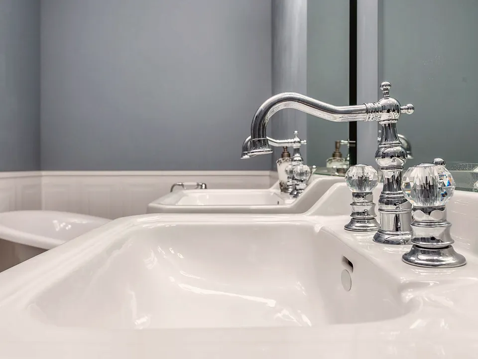 Polished bathroom faucet over a white sink