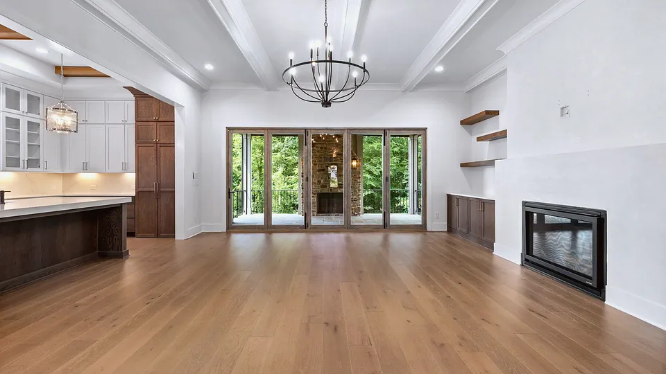 Living room with recessed ceiling lights and a fireplace