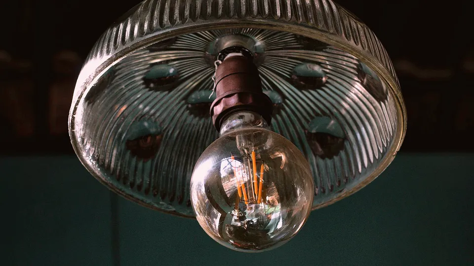 Vintage glass ceiling light with an exposed bulb