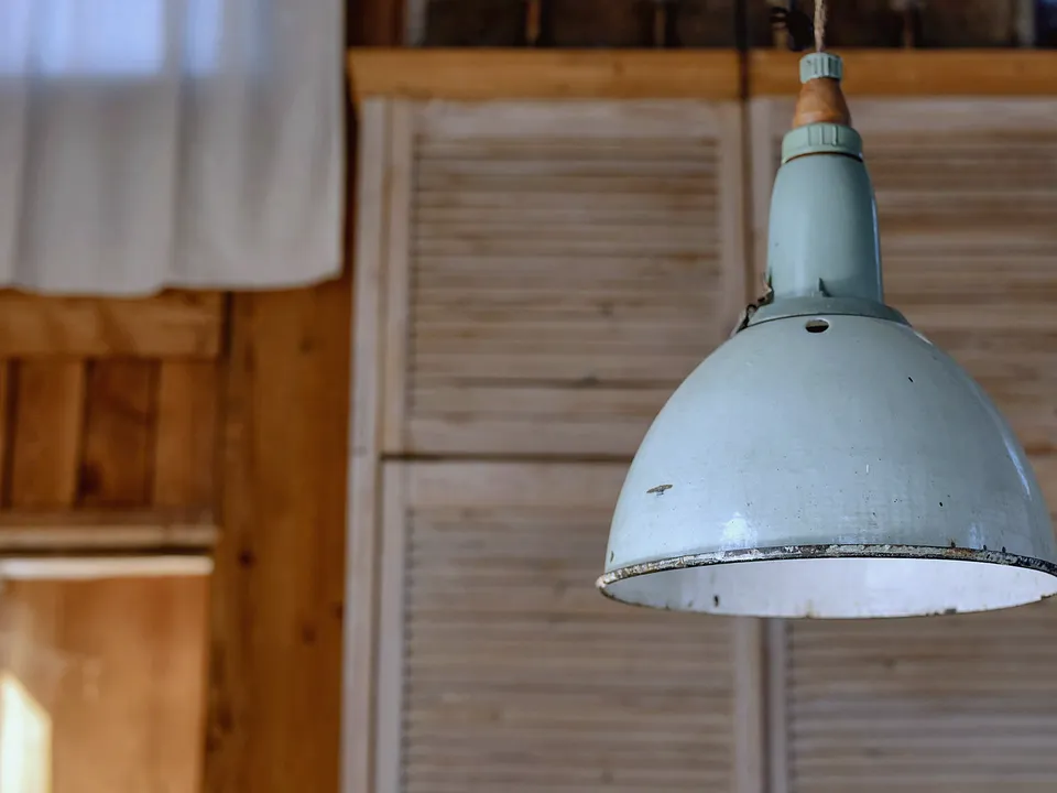 Enamel pendant light hanging from a ceiling