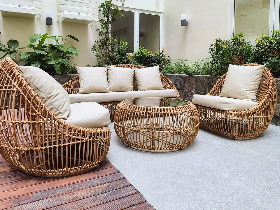Wicker patio furniture on a paved patio