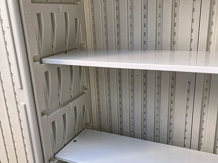 White wall shelves installed level inside a built-in cabinet