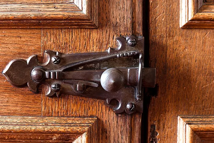 Iron latch on a wooden door