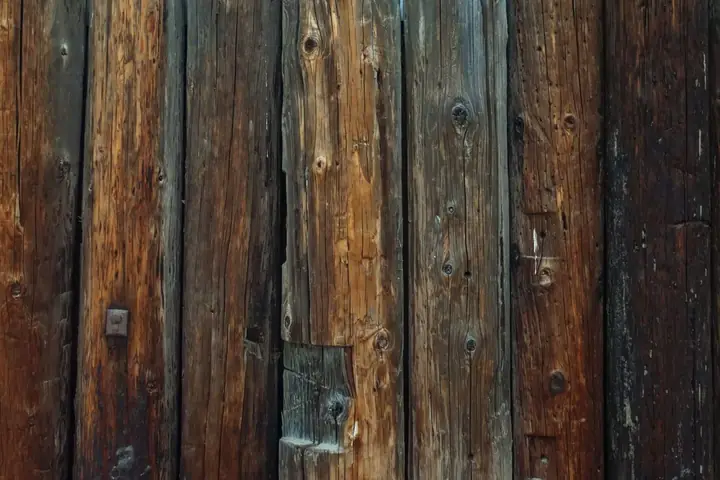 Close view of dark weathered wood fence boards