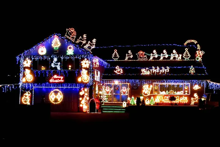House front strung with holiday lights