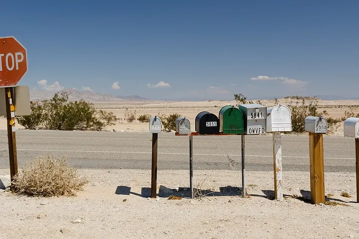 Row of mailboxes along a desert road