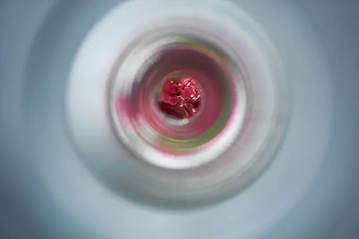 Blurred view through a door peephole lens
