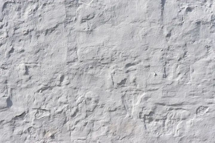 Close view of rough white plaster wall texture