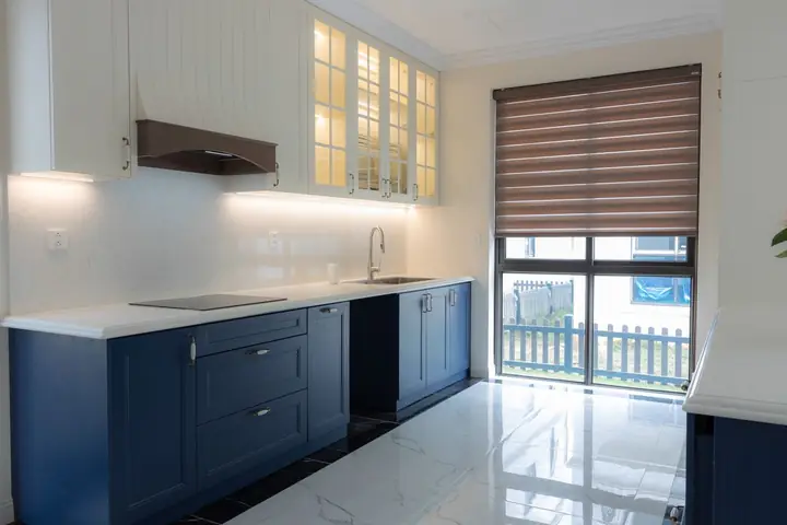 Navy lower cabinets with lights under the upper cabinets